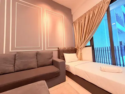a bedroom with a couch and a bed and a window at Colony Greenfield Suites Klcc in Kuala Lumpur