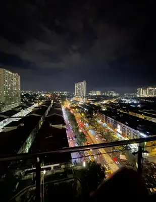 a view of a city at night with traffic at Zetapark condominium in Kuala Lumpur