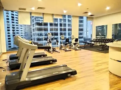a gym with treadmills and exercise equipment in a building at CozyNest Suites Bukit Bintang in Kuala Lumpur