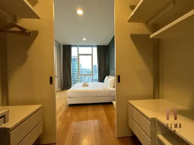 a bedroom with a bed and a large window at The Platinum KLCC by Holma in Kuala Lumpur