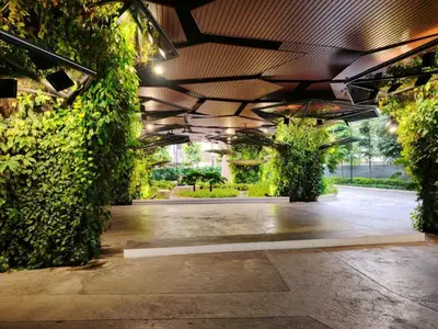 a large building with plants on the side of it at Residensi Continew 5 min walk MRT Train, TRX KL City Centre view Apartment in Kuala Lumpur