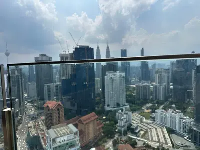 a view of a city from the top of a skyscraper at Agile Suites TRX KlCC in Kuala Lumpur