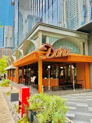 a dunkin donuts building with a sign on it at Agile Suites TRX KlCC in Kuala Lumpur