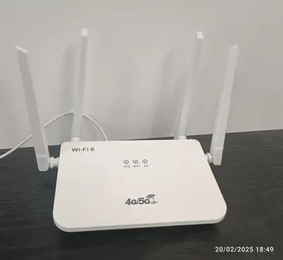 a white laptop computer sitting on top of a table at LSH33 Condo DUKE Sentul KL in Kuala Lumpur