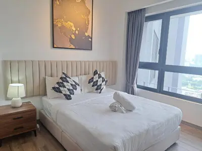 a bedroom with a bed and a window at Agile Malaysia Apartment KL in Kuala Lumpur