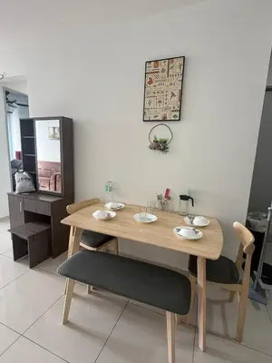 a wooden table and chairs in a room at Cozy Kenwingston Setapak 3BR & 2BR 5-8 Pax l Parking & Netflix 3201 in Kuala Lumpur