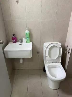 a bathroom with a toilet and a sink at Cozy Kenwingston Setapak 3BR & 2BR 5-8 Pax l Parking & Netflix 3201 in Kuala Lumpur