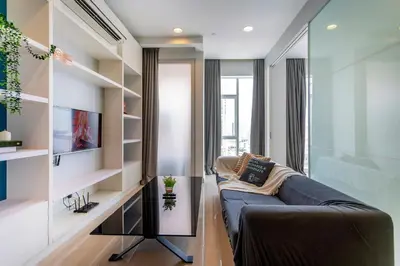 a living room with a couch and shelves at Platinum in Kuala Lumpur