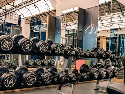 a row of dumbbells on display in a gym at Skyline Homes by Myfly247 in Kuala Lumpur