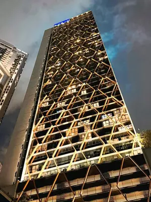 a tall building with a geometric design on it at Skyline Homes by Myfly247 in Kuala Lumpur
