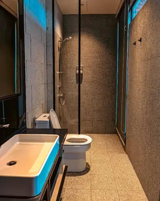 a bathroom with a shower and a toilet and a sink at Skyline Homes by Myfly247 in Kuala Lumpur