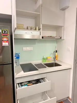 a small kitchen with a sink and a refrigerator at COzy Suite KL Sentral By Riveria City in Kuala Lumpur