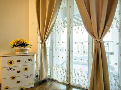 a room with a window with curtains and a dresser at Setapak Central KL - Zetapark Summer Suites in Kuala Lumpur