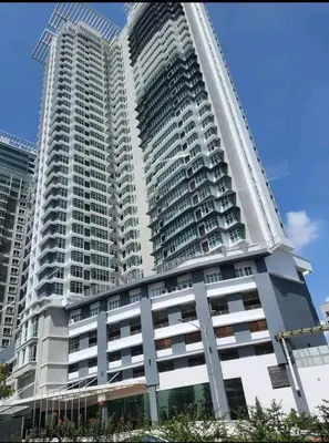 a large white building with two tall buildings at Executive Suite Dua Sentral in Kuala Lumpur