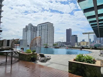 a pool on the roof of a building with a city at Executive Suite Dua Sentral in Kuala Lumpur