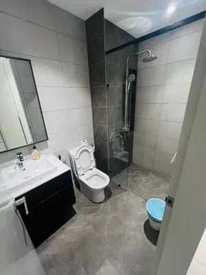 a bathroom with a toilet and a sink and a shower at Axon Residence Bukit Bintang by Comfort Stay in Kuala Lumpur