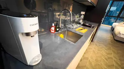 a kitchen counter with a coffee maker on it at Scarletz Suite KLCC by Light House 1 in Kuala Lumpur