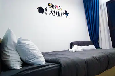 a bedroom with a bed with blue drapes at Trion1 in Kuala Lumpur