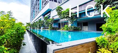 a swimming pool in front of a building at Trion1 in Kuala Lumpur