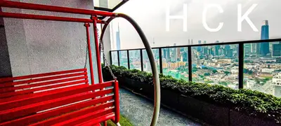 a red bench on top of a building with a view at Trion1 in Kuala Lumpur