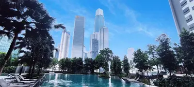 a swimming pool in a city with tall buildings at Agile Service Residence by TRX KLCC in Kuala Lumpur