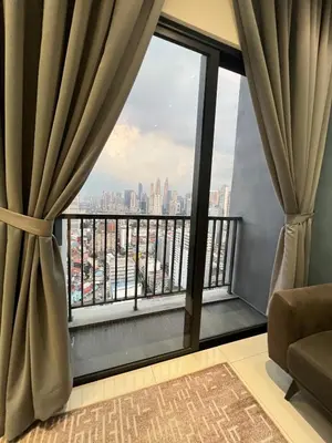 a room with a window with a view of the city at Chambers Vista Suites Urban Haven KLCC in Kuala Lumpur