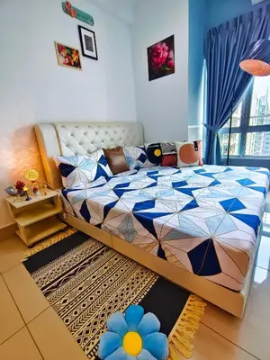 a bedroom with a bed with a blue at Master Room, Razak City Residence in Kuala Lumpur