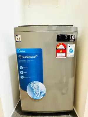 a machine with a sticker on the side of it at The Luxe & Colony KLCC By LuxeHub in Kuala Lumpur