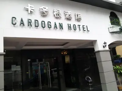 a sign for a canadian hotel on a building at Cardogan Hotel in Kuala Lumpur