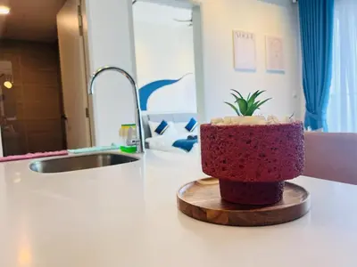a red cake sitting on top of a kitchen counter at trion kl TRX klcc view in Kuala Lumpur