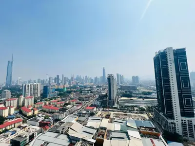 an aerial view of a city with tall buildings at trion kl TRX klcc view in Kuala Lumpur