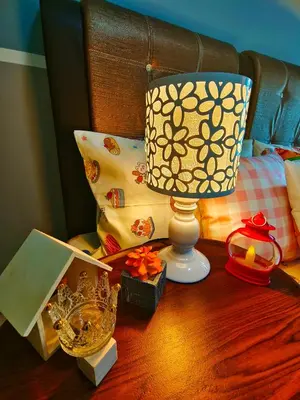 a table with a lamp and other items on it at Master Room at Razak City Residence in Kuala Lumpur