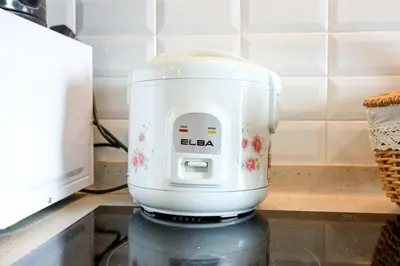 a white mixer sitting on top of a counter at Premium Stay Central KL Next to TRX Mall & IKEA in Kuala Lumpur