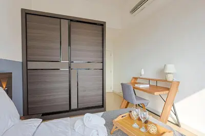 a living room with a large sliding glass door at Premium Stay Central KL Next to TRX Mall & IKEA in Kuala Lumpur
