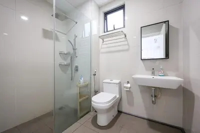 a bathroom with a toilet and a sink and a shower at Premium Stay Central KL Next to TRX Mall & IKEA in Kuala Lumpur