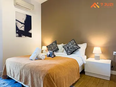 a bedroom with two stuffed animals on a bed at SkyPool KLCC 2BR Platinum Suite D33F with Netflix in Kuala Lumpur