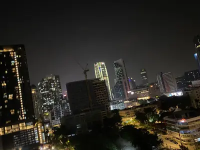 a city skyline at night with tall buildings at Comfort Suites At Quill Residence in Kuala Lumpur