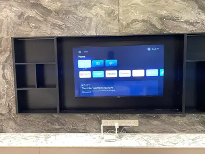 a flat screen tv sitting on a wall at Comfort Suites At Quill Residence in Kuala Lumpur