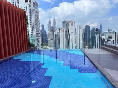 a swimming pool on the roof of a building at Majestic Premium suites KLCC in Kuala Lumpur