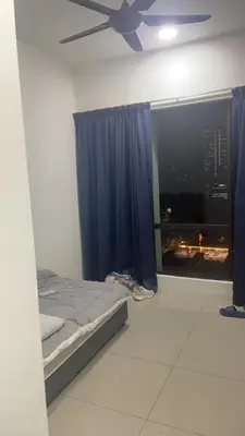 a bedroom with a bed and a ceiling fan at \u670d\u52a1\u5f0f\u516c\u5bd3 in Kuala Lumpur