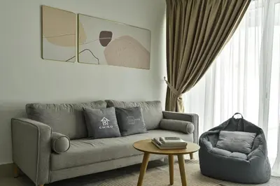 a living room with a couch and a table at Jln Razak Mansion, in Kuala Lumpur