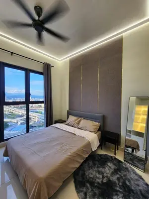 a bedroom with a bed and a ceiling fan at trion Klcc 2 bedroom apartment in Kuala Lumpur
