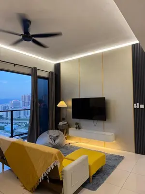 a living room with a ceiling fan and a television at klcc 2 bedroom trion in Kuala Lumpur