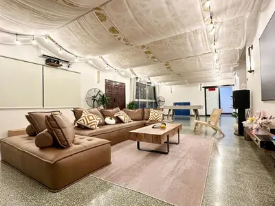 a living room with a couch and a table at The Little Bali - 6Room - 18Pax in Kuala Lumpur