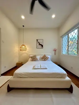 a bedroom with a large white bed in a room at The Little Bali - 6Room - 18Pax in Kuala Lumpur