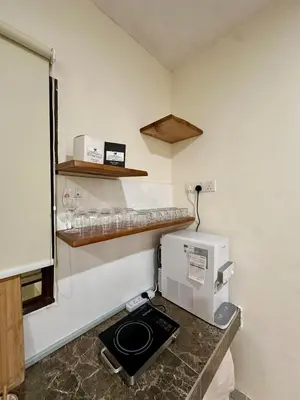 a kitchen with a coffee maker on a counter at The Little Bali - 6Room - 18Pax in Kuala Lumpur