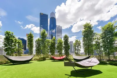 three hammocks in a park with a city skyline at Agile Bukit Bintang by Avery at KLCC#5 mins to Pavilion &TRX#Garden Pool#Free Parking#中英文房东 in Kuala Lumpur