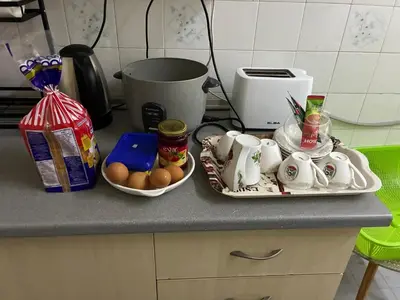 a kitchen counter with a tray of food on it at Baiduri Homestay in Kuala Lumpur