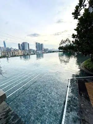 a large body of water with a city in the background at M Vertica Homestay in Kuala Lumpur
