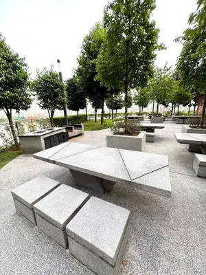 a group of benches sitting in a park at M Vertica Homestay in Kuala Lumpur